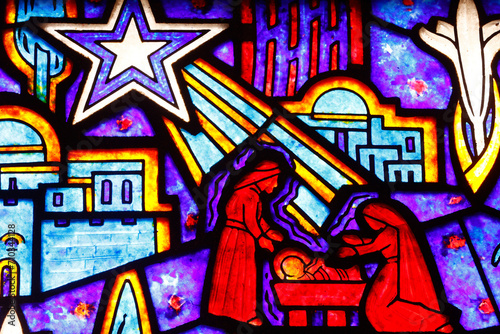 Saint Helier church. Stained glass. Nativity of Jesus or birth of Christ. The nativity is the basis for the Christian holiday of Christmas on December 25. Bleuzeville. France.