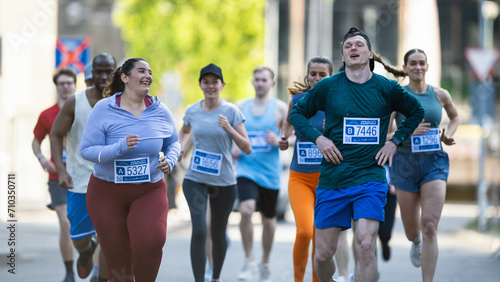 Group of Diverse People Running in a Marathon with the Cheers of their Loved Ones and Supporters in the Audience. Runners Participating in a Charity Run to Raise Money a Cause