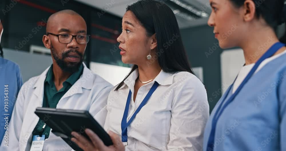 Discussion, tablet or team of doctors in meeting planning a surgery strategy in collaboration in hospital. Talking, healthcare workers or nurses speaking of online news report, feedback or research