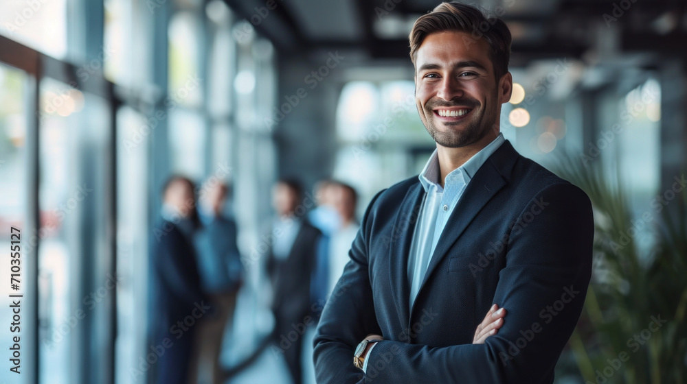 Portrait of a handsome smiling businessman boss standing in his modern business company office. Portrait of a handsome smiling businessman boss standing in his modern business company office.