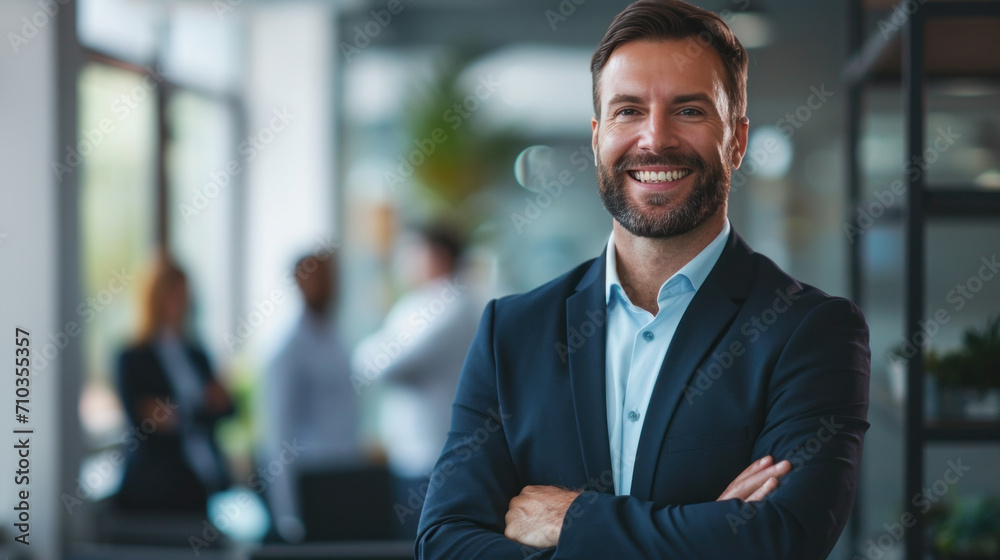 Portrait of a handsome smiling businessman boss standing in his modern business company office. Portrait of a handsome smiling businessman boss standing in his modern business company office.