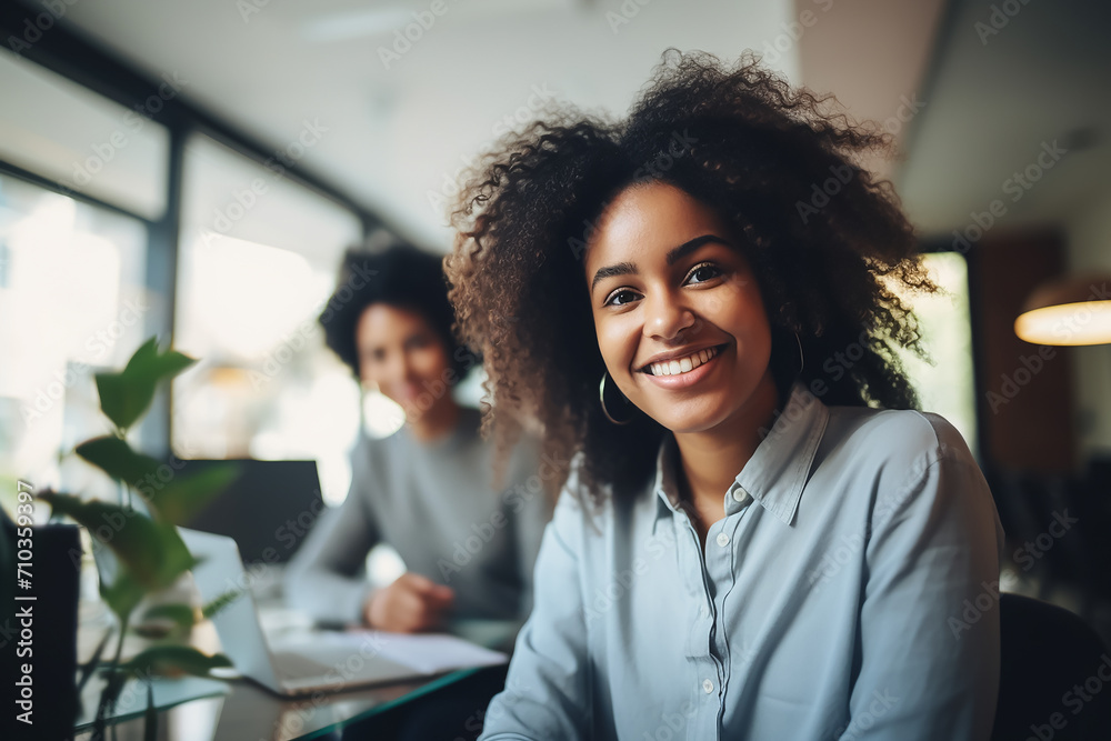 A happy professional black woman, light blurry background A happy professional black woman, light blurry background