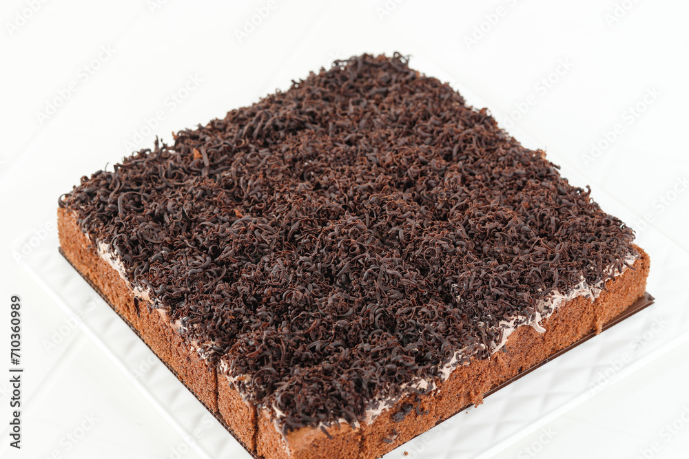 Sliced Chocolate Sponge Cake with Shredded Chocolate Toppin Sliced Chocolate Sponge Cake with Shredded Chocolate Toppin