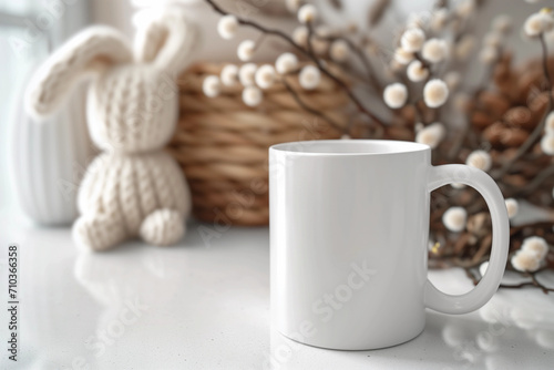 Easter blank mug POD product mockup with empty space on table with yarn wool knitted toy bunny, basket and flowers in the background for creative crafting earthy rural farmhouse boho style marketing  photo