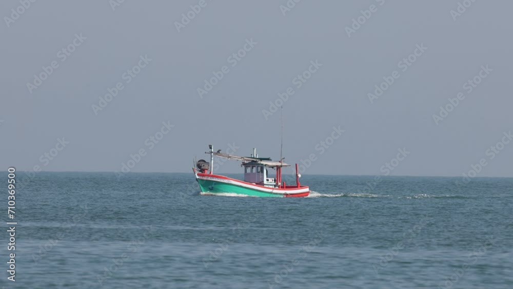Fishing Boat Sailing Across Calm Sea Fishing Boat Sailing Across Calm Sea