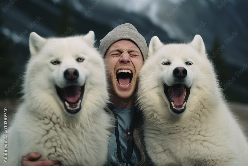 young man laughing with two huskies dogs bokeh style background