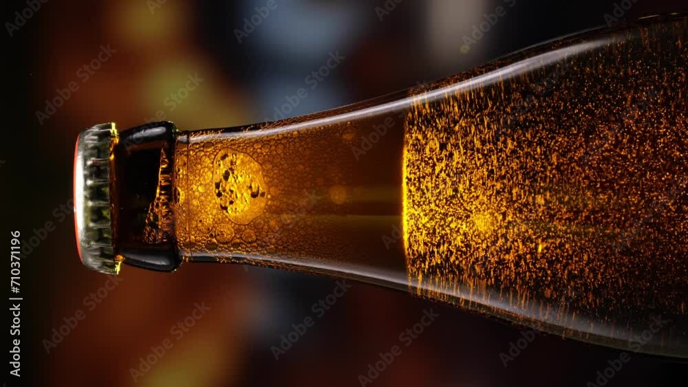beer bottle featuring lively bubbles and frothy foam, bar counter in background. Brown glass bottles with golden beer, alcoholic drink, refreshing summer beverage and embodying spirit of Oktoberfest