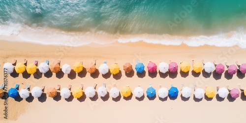 Aerial view to colorful beach with umbrellas