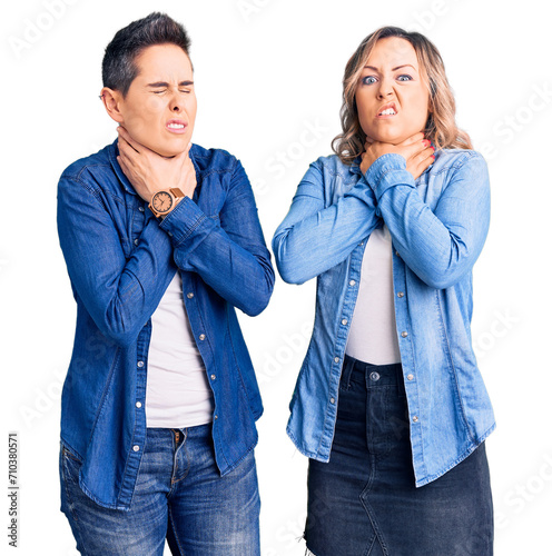 Couple of women wearing casual clothes shouting suffocate because painful strangle. health problem. asphyxiate and suicide concept.