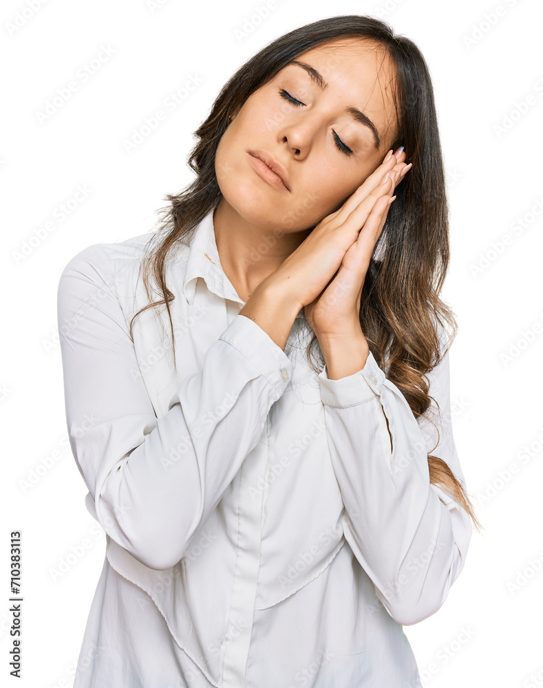 Young brunette woman wearing casual clothes sleeping tired dreaming and posing with hands together while smiling with closed eyes. Young brunette woman wearing casual clothes sleeping tired dreaming and posing with hands together while smiling with closed eyes.