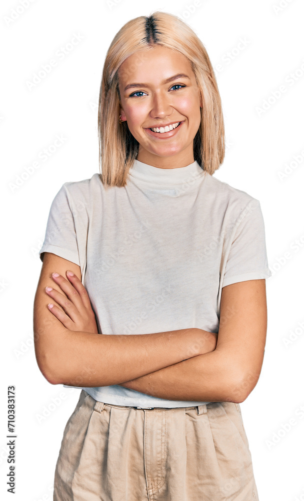 Beautiful young blonde woman wearing casual white t shirt happy face smiling with crossed arms looking at the camera. positive person. Beautiful young blonde woman wearing casual white t shirt happy face smiling with crossed arms looking at the camera. positive person.