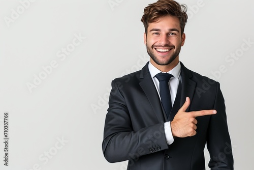 Showing a good mood: A man smiling and pointing his finger at the wall Resulting in good results that are full of positive energy. This image beautifully captures the nature of confidence and willingn photo