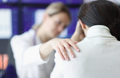 Physician holds upset patient's shoulder sympathetically. Psychological pressure with illness concept