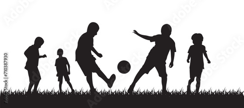 kid playing soccer silhouette