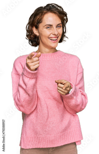 Young hispanic woman wearing casual clothes pointing fingers to camera with happy and funny face. good energy and vibes.