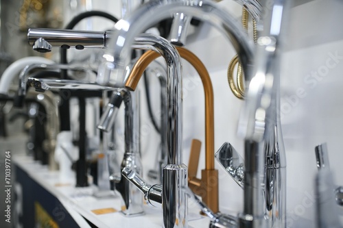 Modern kitchen and bathroom water faucets in the store
