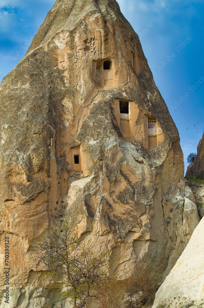 Typical Cappadocia landscape soft volcanic rock, shaped by erosion in Goreme, Turkey.