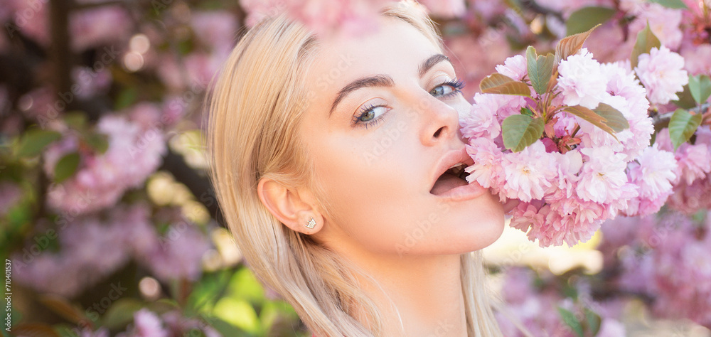 Sensual woman near sakura tree background, banner for website header. Beautiful girl in pink flowers in blossom park. Cherry blossom of Spring, Sensual woman near sakura tree background, banner for website header. Beautiful girl in pink flowers in blossom park. Cherry blossom of Spring,