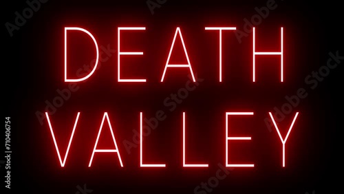 Flickering red retro style neon sign glowing against a black background for DEATH VALLEY