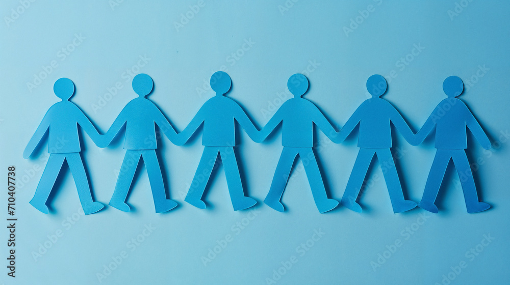 Blue paper cutout figures holding hands, symbolizing unity and teamwork on a light blue background. Blue paper cutout figures holding hands, symbolizing unity and teamwork on a light blue background.