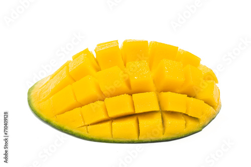 Cut into cubes fresh organic green mango delicious fruit side view isolated on white background clipping path
