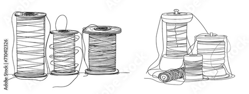 Spools of thread in one continuous line drawing.