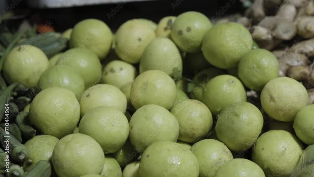 Raw Green Organic fresh lemon vegetables at retail store for sale at evening Raw Green Organic fresh lemon vegetables at retail store for sale at evening