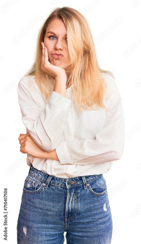 Young beautiful blonde woman wearing casual shirt thinking looking tired and bored with depression problems with crossed arms. Young beautiful blonde woman wearing casual shirt thinking looking tired and bored with depression problems with crossed arms.
