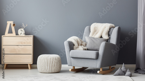 Comfortable armchair near light grey wall indoors.