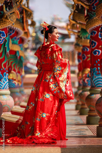 Canvas Print Chinese new year , Portrait of young asian woman with traditional red Chinese ho