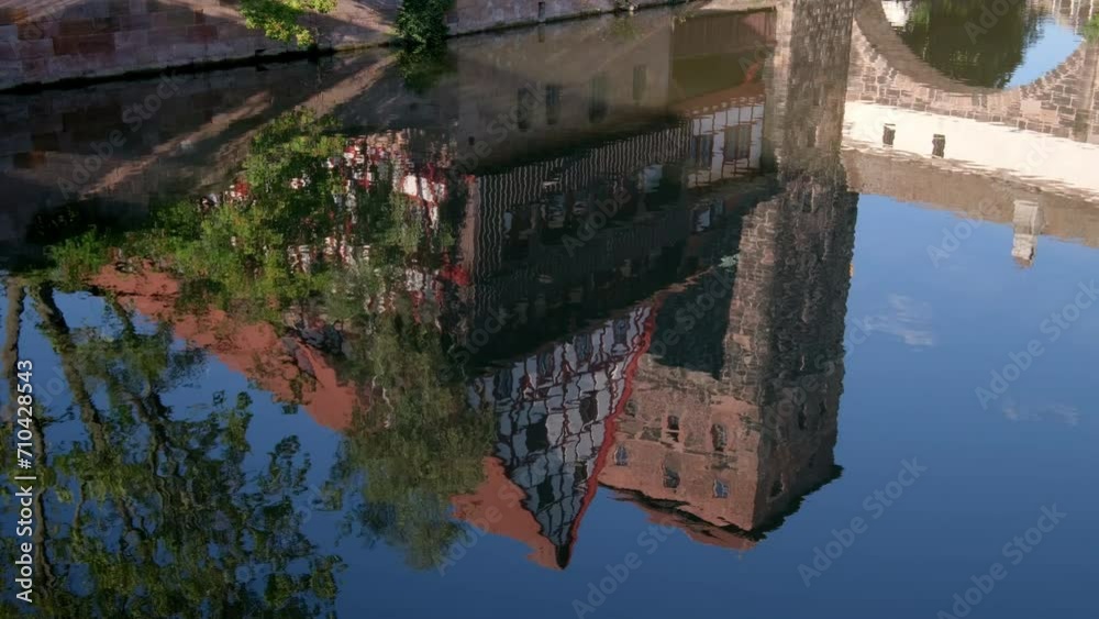 Reflection of Wasserturm in the River Pegnitz in Nuremberg, Germany. Taken on a still summer after noon