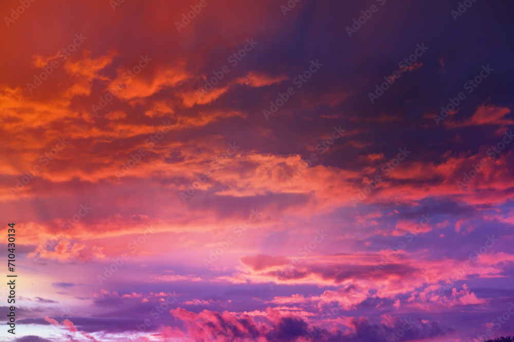 Fototapeta premium Beautiful sunset sky above clouds with dramatic light. Cabin view from airplane