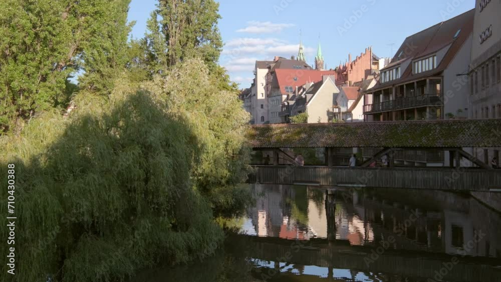 Close static clip of the Hangmans Bridge in Nuremberg on a still summer afternoon. Tourists take photos from the bridge Close static clip of the Hangmans Bridge in Nuremberg on a still summer afternoon. Tourists take photos from the bridge