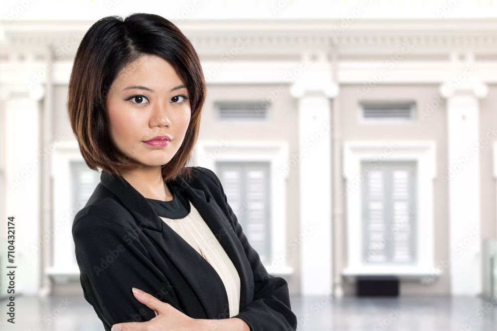 Chinese business woman in front of historic Building. Chinese business woman in front of historic Building.