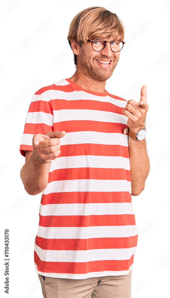 Handsome caucasian man with beard wearing casual clothes and glasses pointing fingers to camera with happy and funny face. good energy and vibes. Handsome caucasian man with beard wearing casual clothes and glasses pointing fingers to camera with happy and funny face. good energy and vibes.