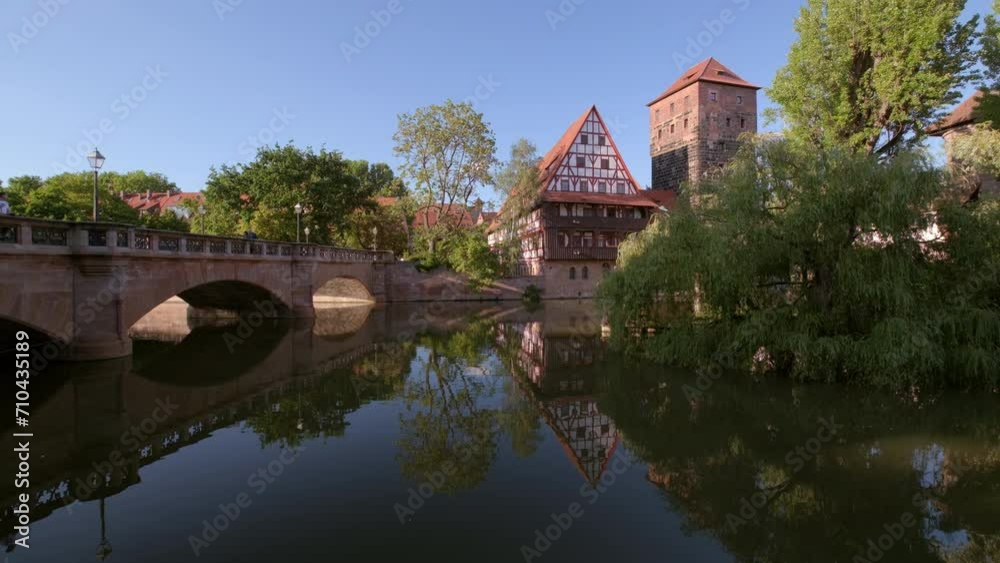 Static wide clip of Wasserturm and Maxbrucke on the River Pegnitz in Nuremberg, Germany. Taken on a still summer afternoon Static wide clip of Wasserturm and Maxbrucke on the River Pegnitz in Nuremberg, Germany. Taken on a still summer afternoon