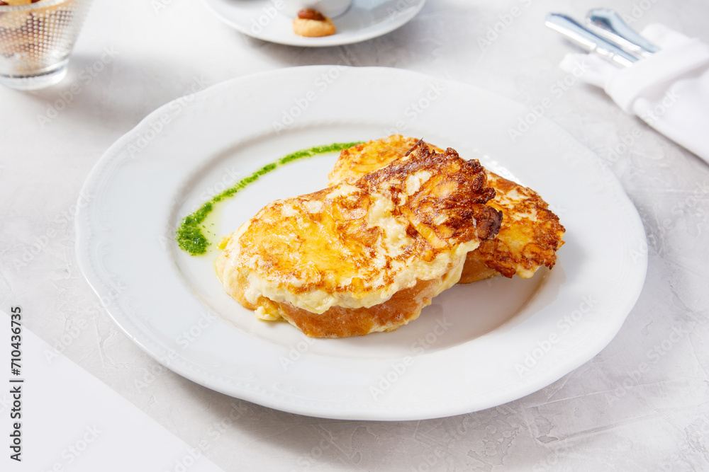 Toast with cheese, bread fried in eggs, breakfast in a cafe Toast with cheese, bread fried in eggs, breakfast in a cafe