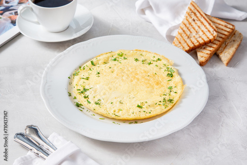 Egg omelet with herbs for breakfast