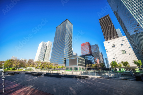 Spacious Urban Plaza with Modern Skyscrapers and Benches © evening_tao