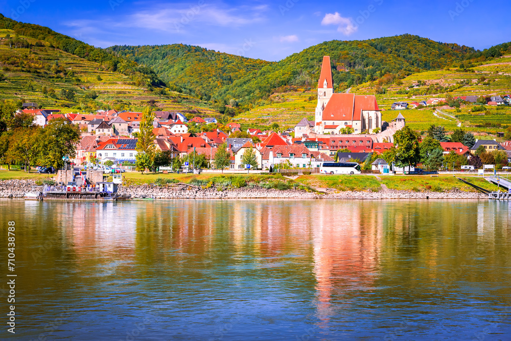 Weissenkirchen, Austria. Wachau Valley on Danube River, autumn colored leaves and vineyards on a sunny day.