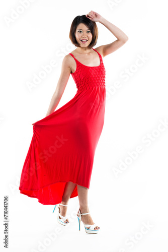 Happy Chinese woman wearing red summer dress