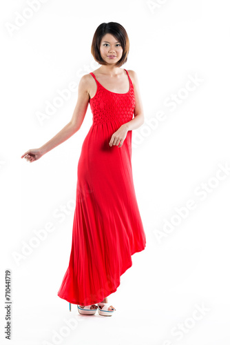 Happy Chinese woman wearing red summer dress