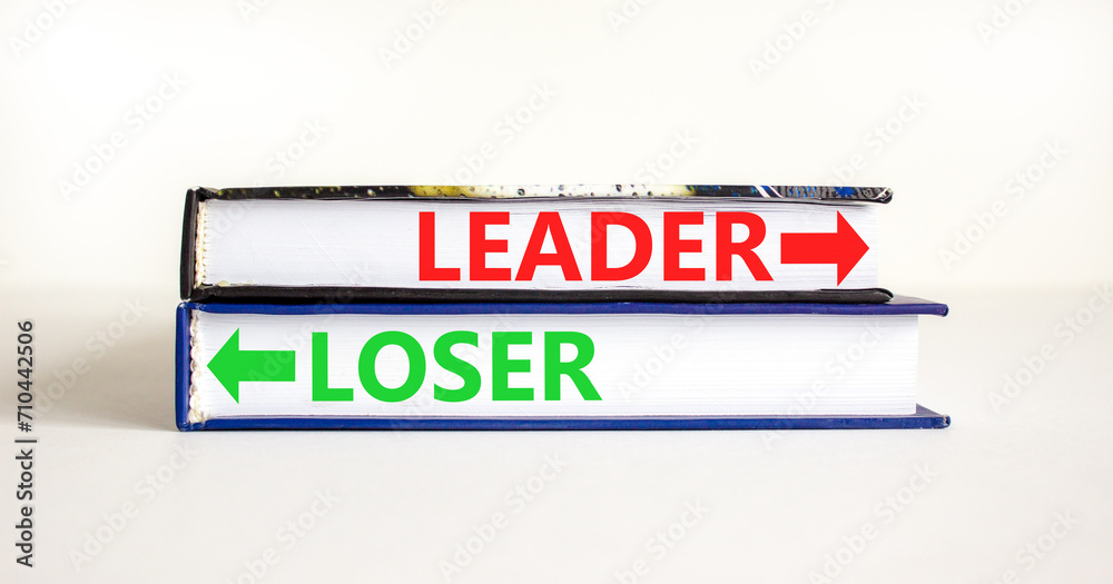 Leader or loser symbol. Concept word Leader or Loser on beautiful books. Beautiful white table white background. Business and leader or loser concept. Copy space.