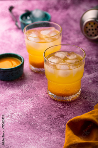 Summer cocktail with mango juice and ice