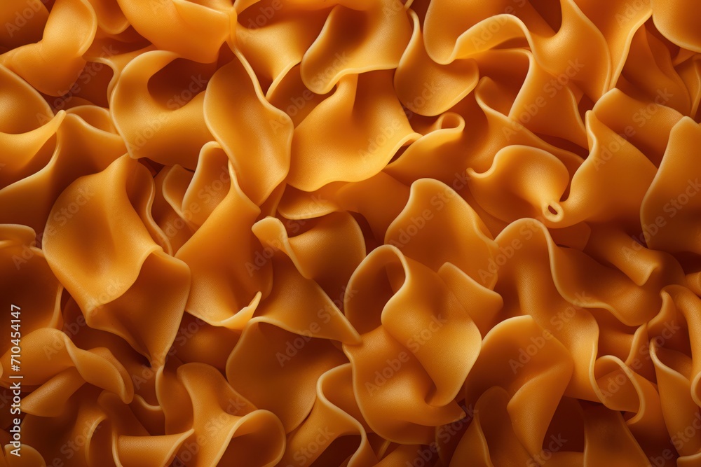 Abstract yellow pasta or pasta background with waves and folds. Pasta production
