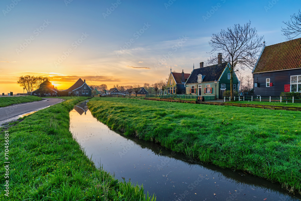 Obraz premium Sunrise at Zaanse Schans village with Dutch traditional house near Amsterdam Netherlands