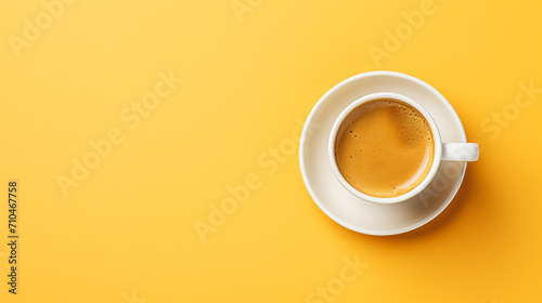 Top view cup of coffee latte on yellow background