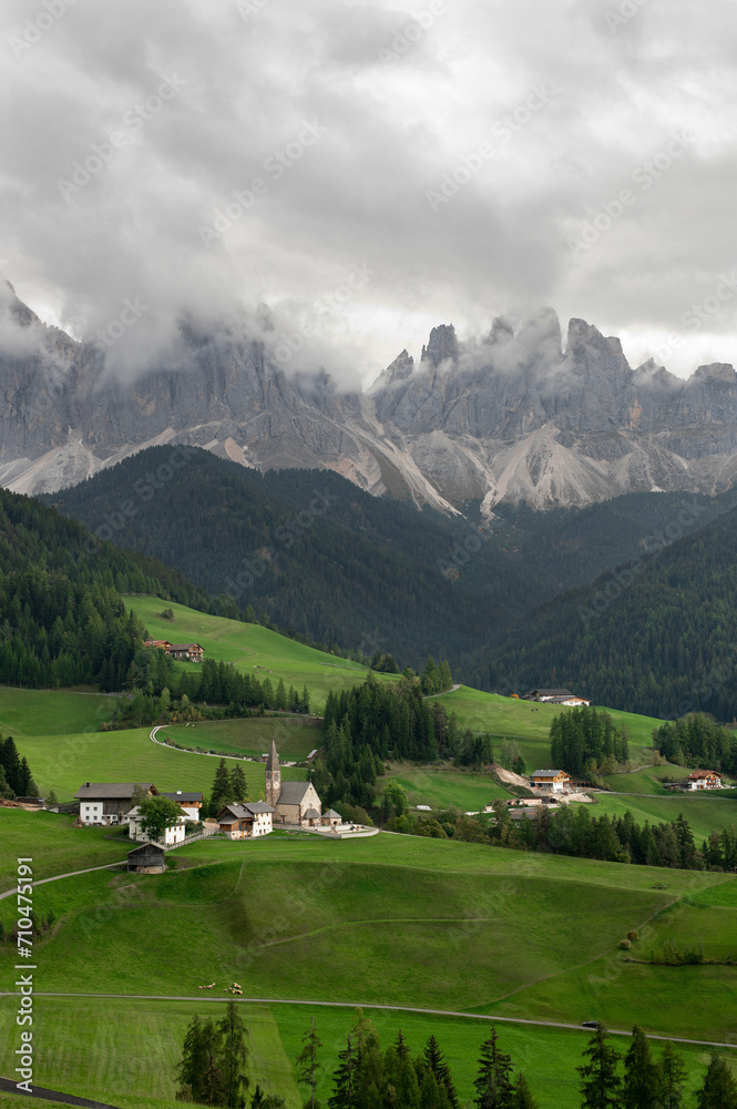Stunning view of the Val di Funes with the Santa Maddalena Church and the mountain ridge. View on the Odle Dolomites mountain rocks in Santa Magdalena, Italy. Dolomites Alps, South Tyrol
