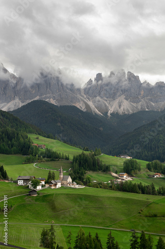 Stunning view of the Val di Funes with the Santa Maddalena Church and the mountain ridge. View on the Odle Dolomites mountain rocks in Santa Magdalena, Italy. Dolomites Alps, South Tyrol