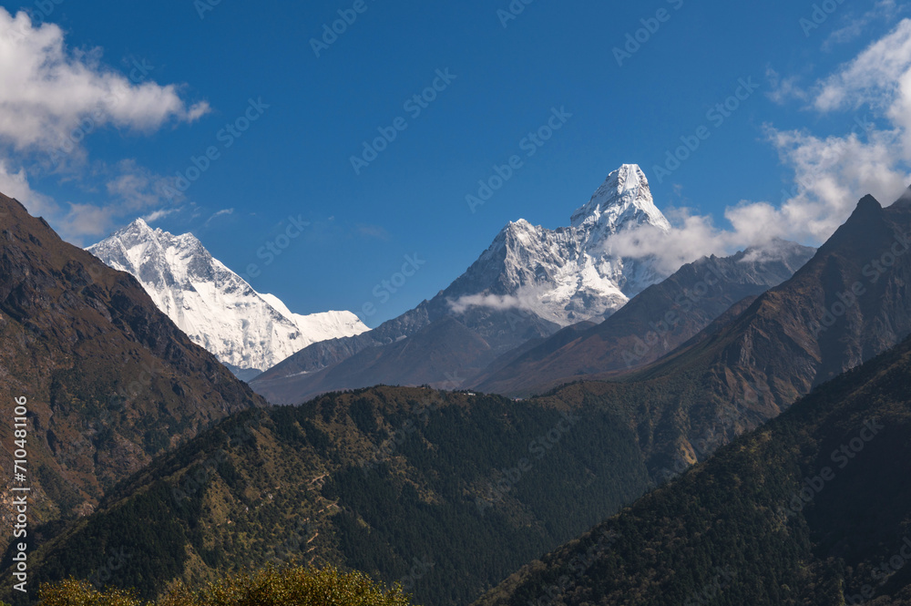 View of Lhotse and Ama Dablam mountains during trekking in Nepal in a clear day. EBC Everest Base Camp or Three passes trek in Nepal. Mountain range Himalayas in the Khumbu region of Nepal, Asia.